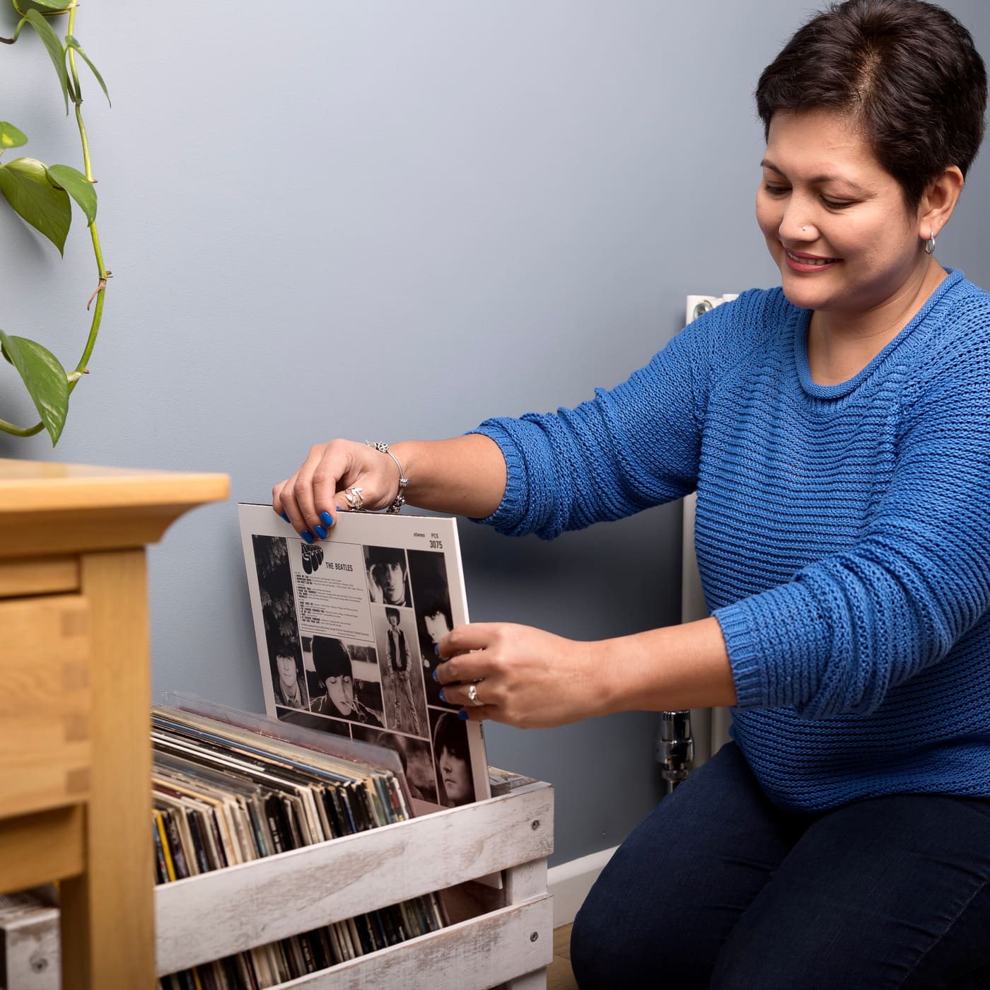 Karla sorting a vinyl record collection